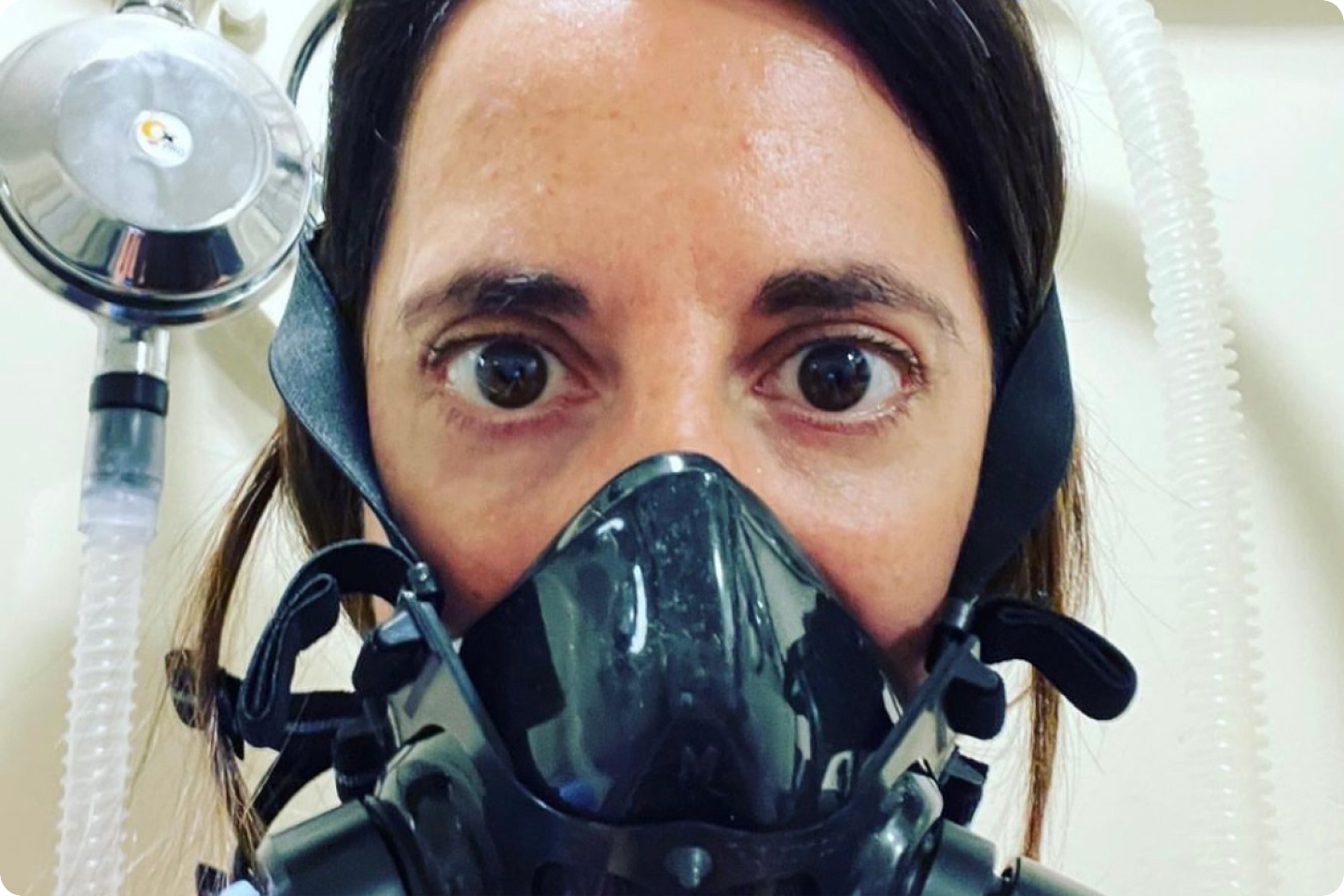 Photo of Georgina wearing an Oxygen mask during a session