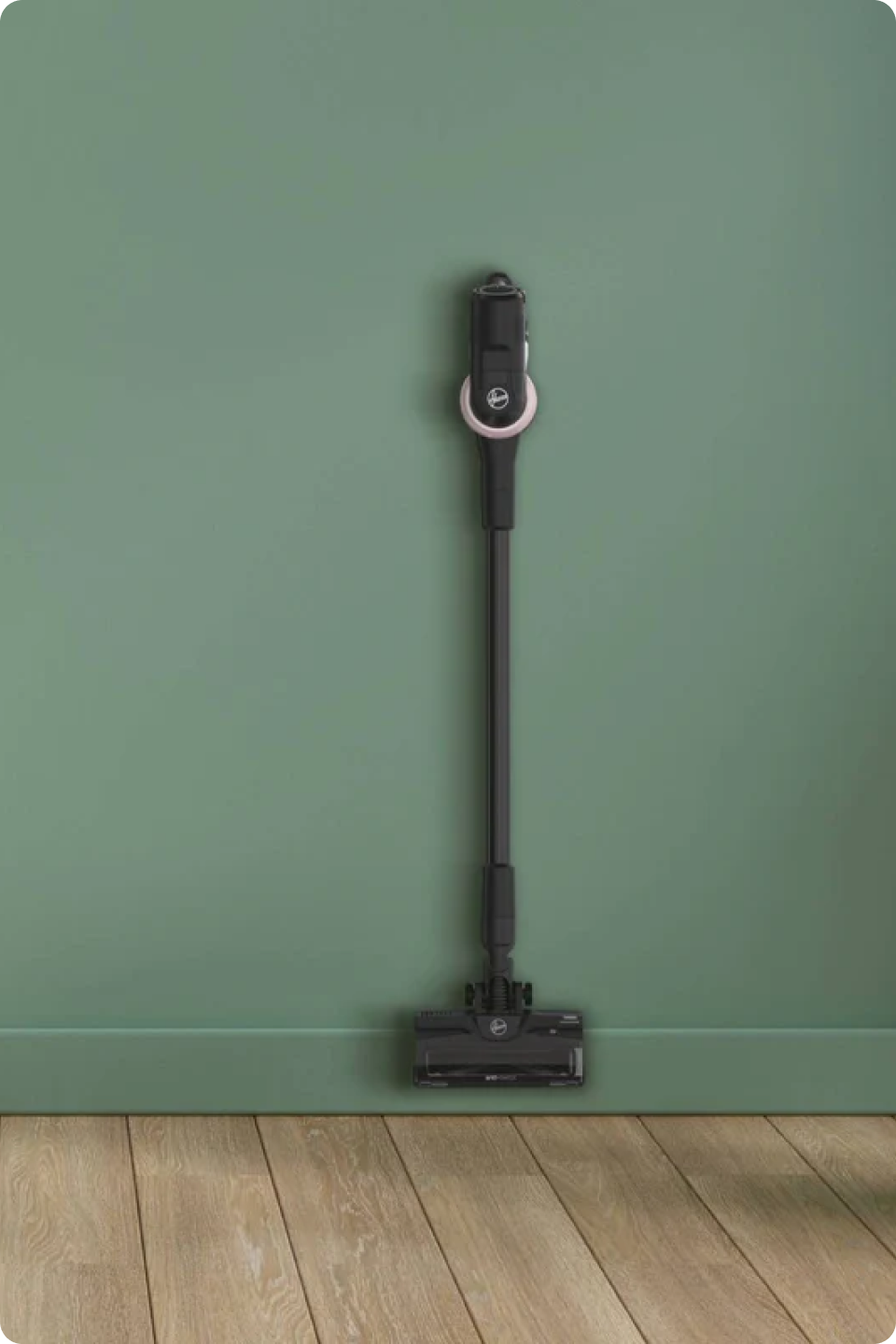 Hoover Cordless Vacuum Cleaner with Anti Hair Wrap - HF4: Special Edition hanging on a green wall