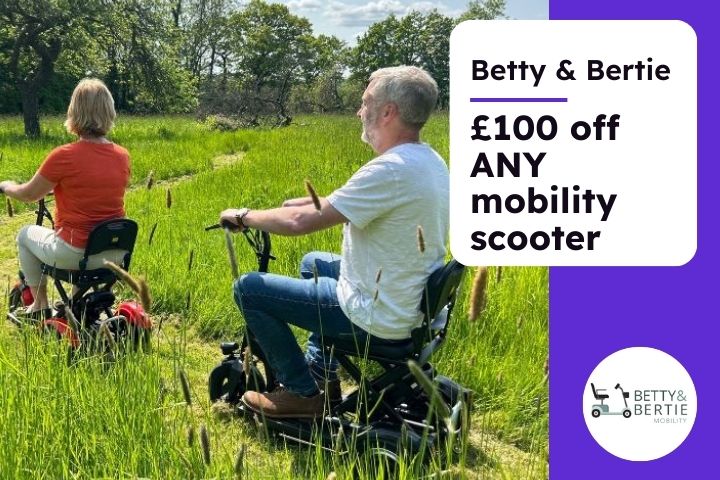 A man and a woman using mobility scooters and riding through countryside and grass, the text reads Betty and Bertie £100 off any mobility scooter