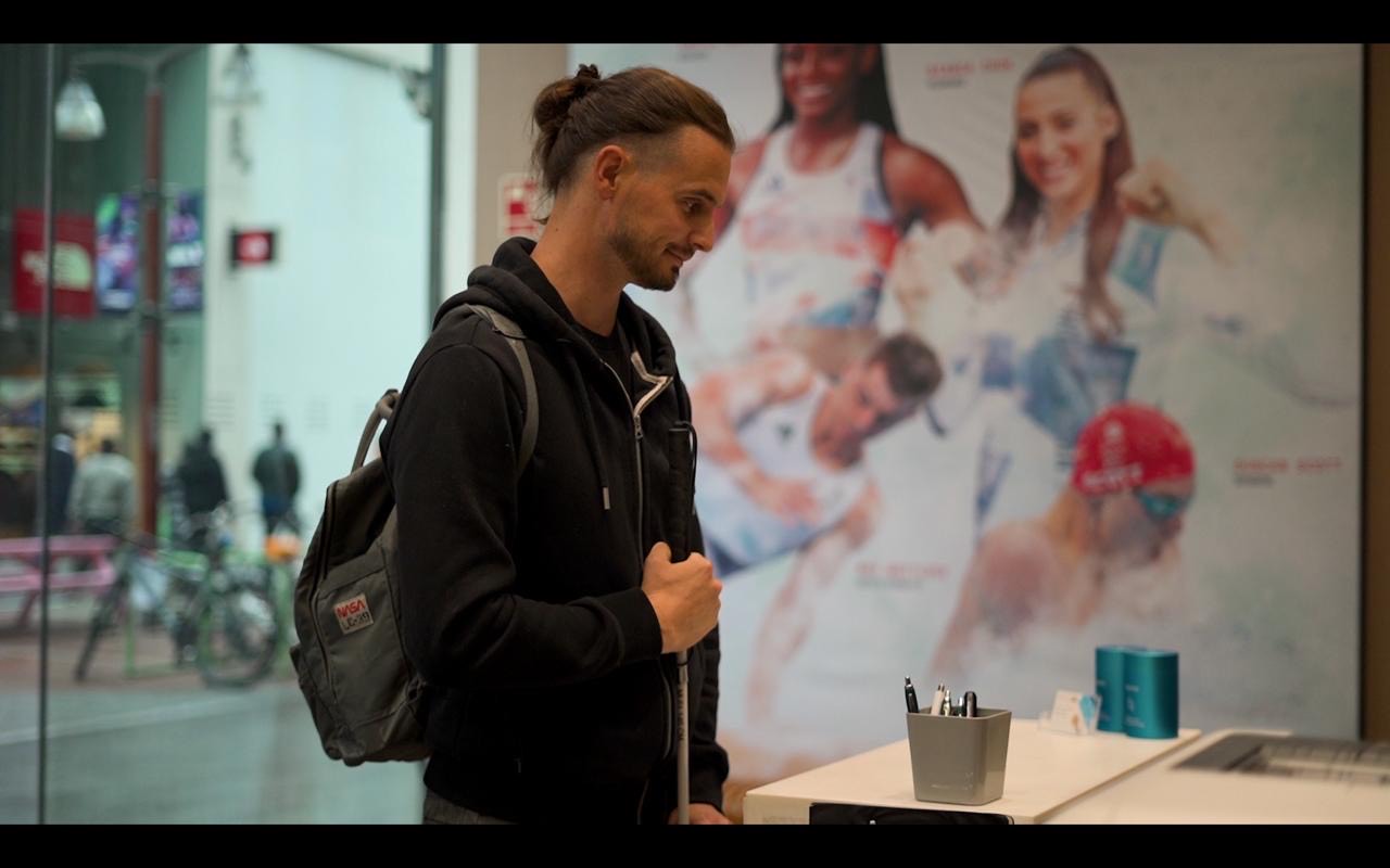 Man with a backpack visiting a health care screening centre at Randox Discounts for Disabled community