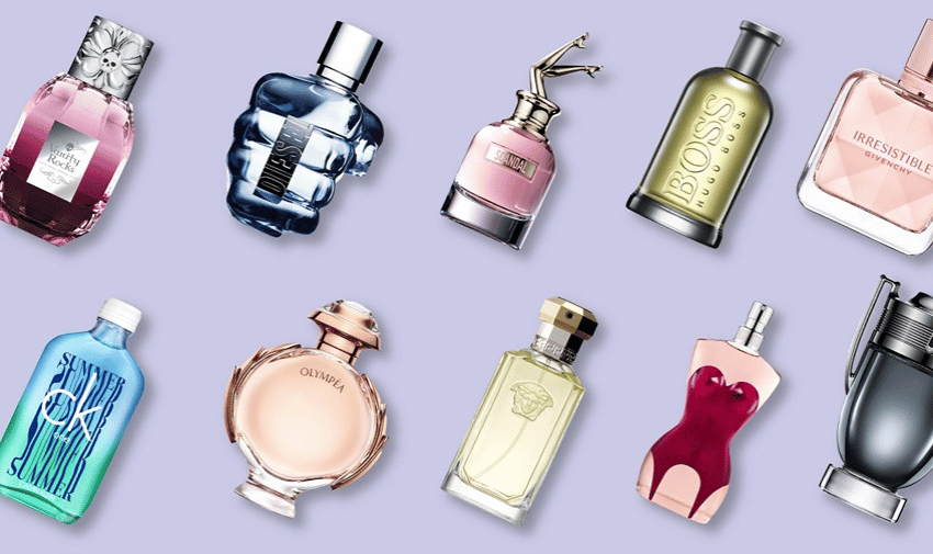 Pale purple background with a variety of different perfume and aftershave bottles on it, from the fragrance shop discount codes page of purpl