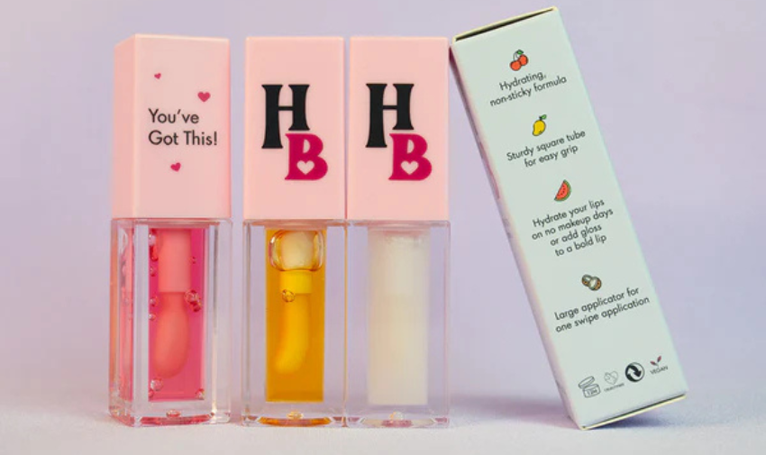 Human Beauty three lipglosses that have a HB logo and the text You've Got This!