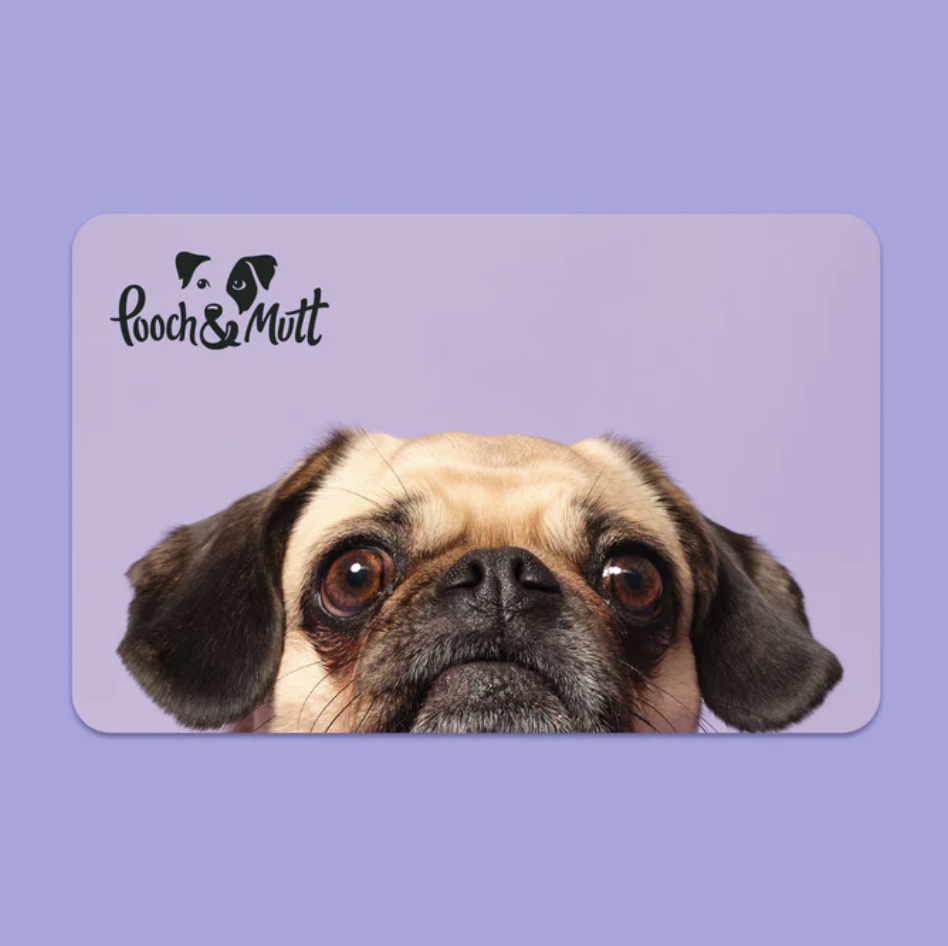 A purple background with a gift card from pooch and mutt with a small cute dogs face on it