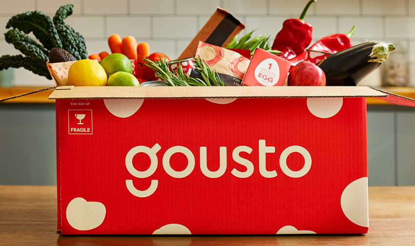 Gousto red box of ingredients on a kitchen table