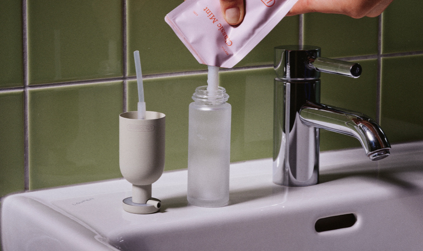 A bathroom sink with a refillable toothpaste from Life Supplies