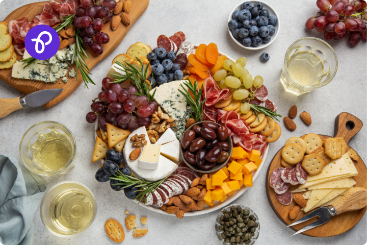 A table laid with a cheese board and charcuterie for a post about galentines day plans at home