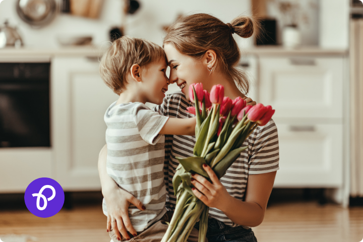 A mother is hugging a small boy and holding a bunch of tulips in a blog post about Mothers Day gift ideas and Purpl Disabled Discounts