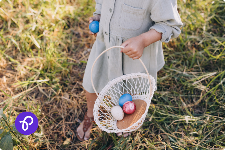 A child holding a basket at an easter egg hunt