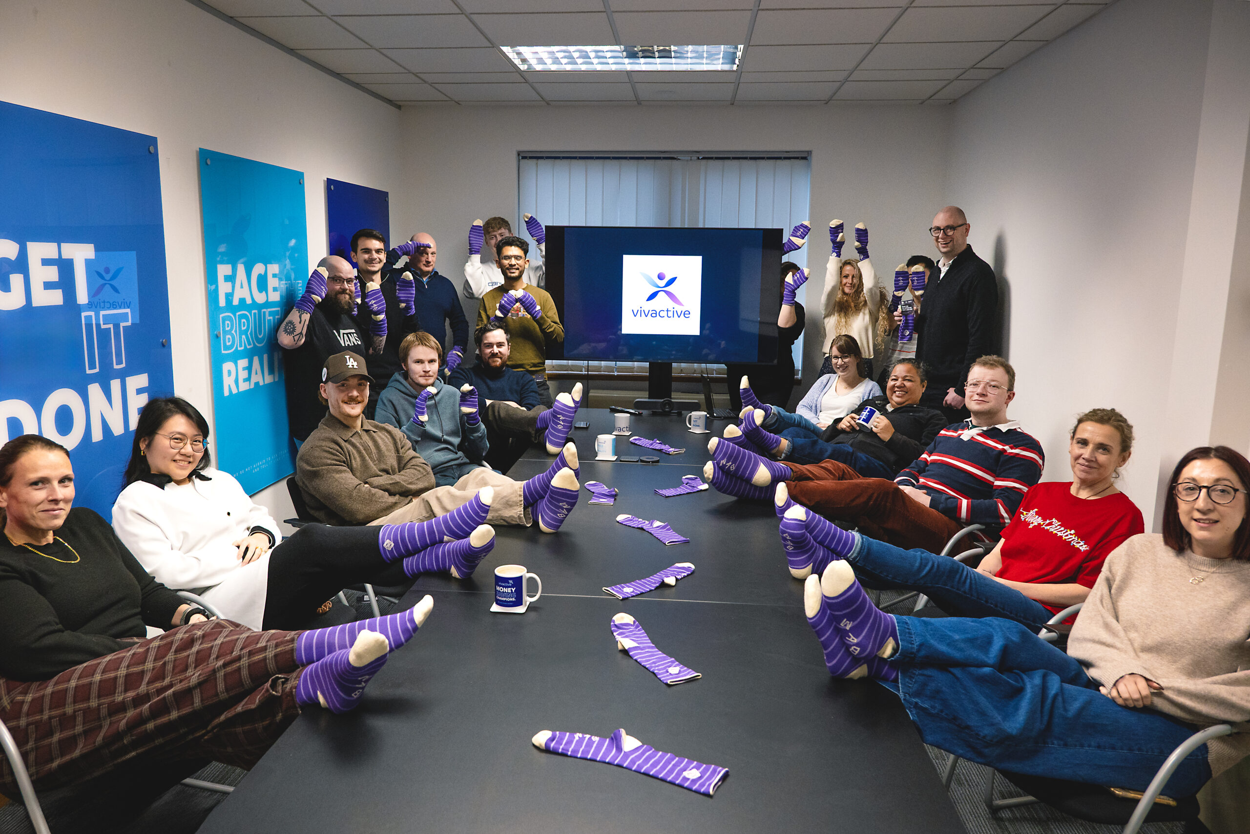 Team members from Vivactive wearing purple socks for Purple Sock Day to raise awareness of people living with disabilities and long term health conditions, supporting inclusion and highlighting Purpl discounts alongside shopping discounts for disabled people, disabled travel discounts UK, and mobility discounts and offers.