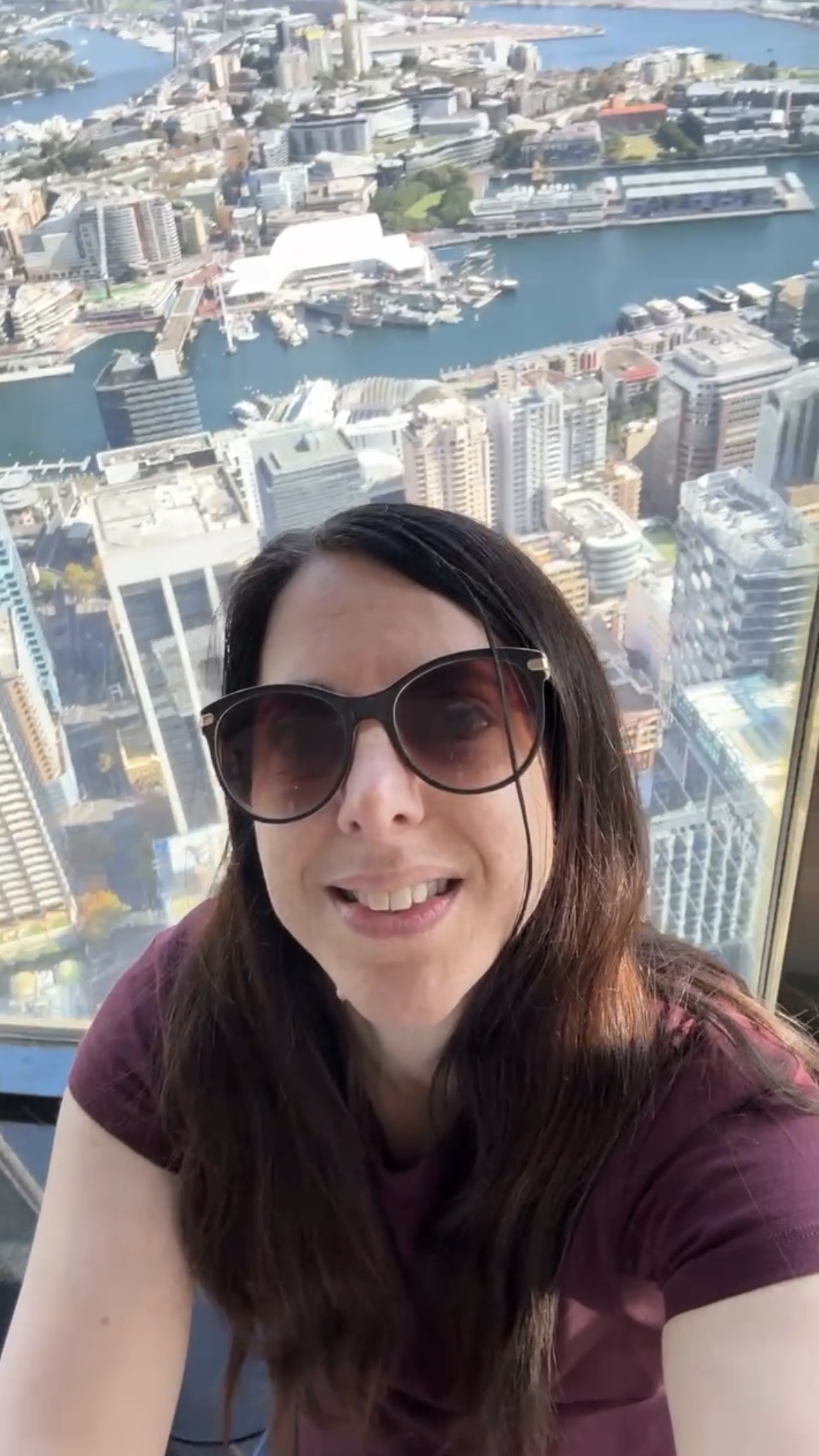 Georgina at Sydney Tower Eye overlooking Sydney Harbour and the city skyline during an accessible travel review of Sydney for disabled people.